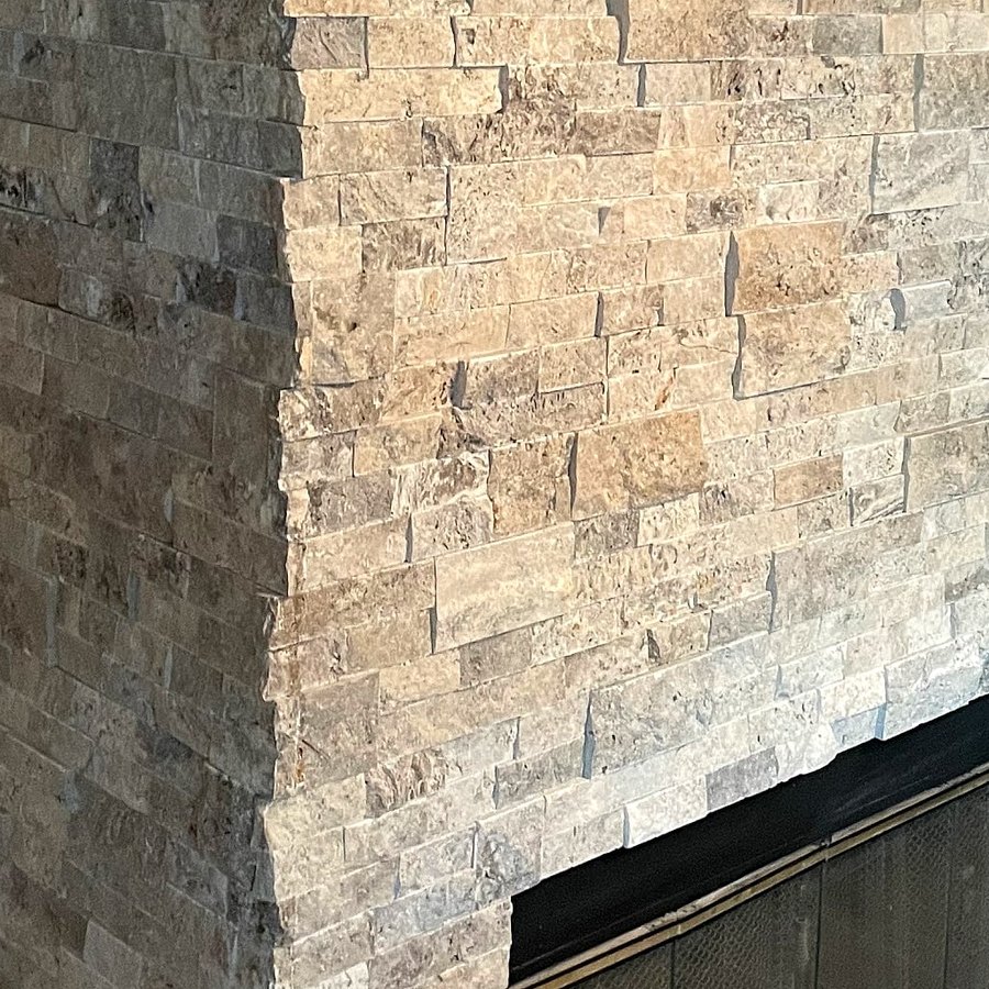 Close-up of a stacked stone fireplace corner
