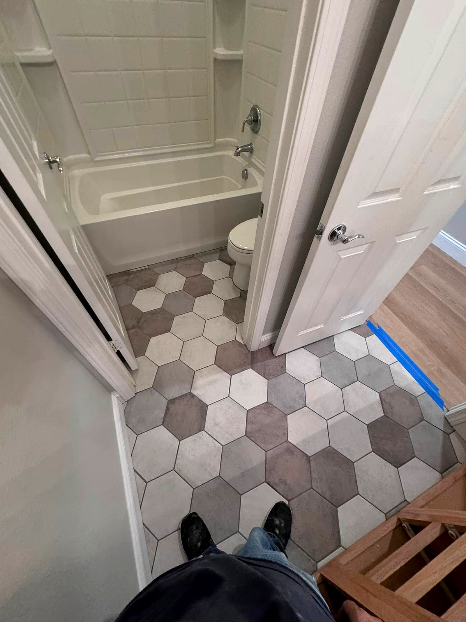 Bathroom floor in large grey and white hexagon tile