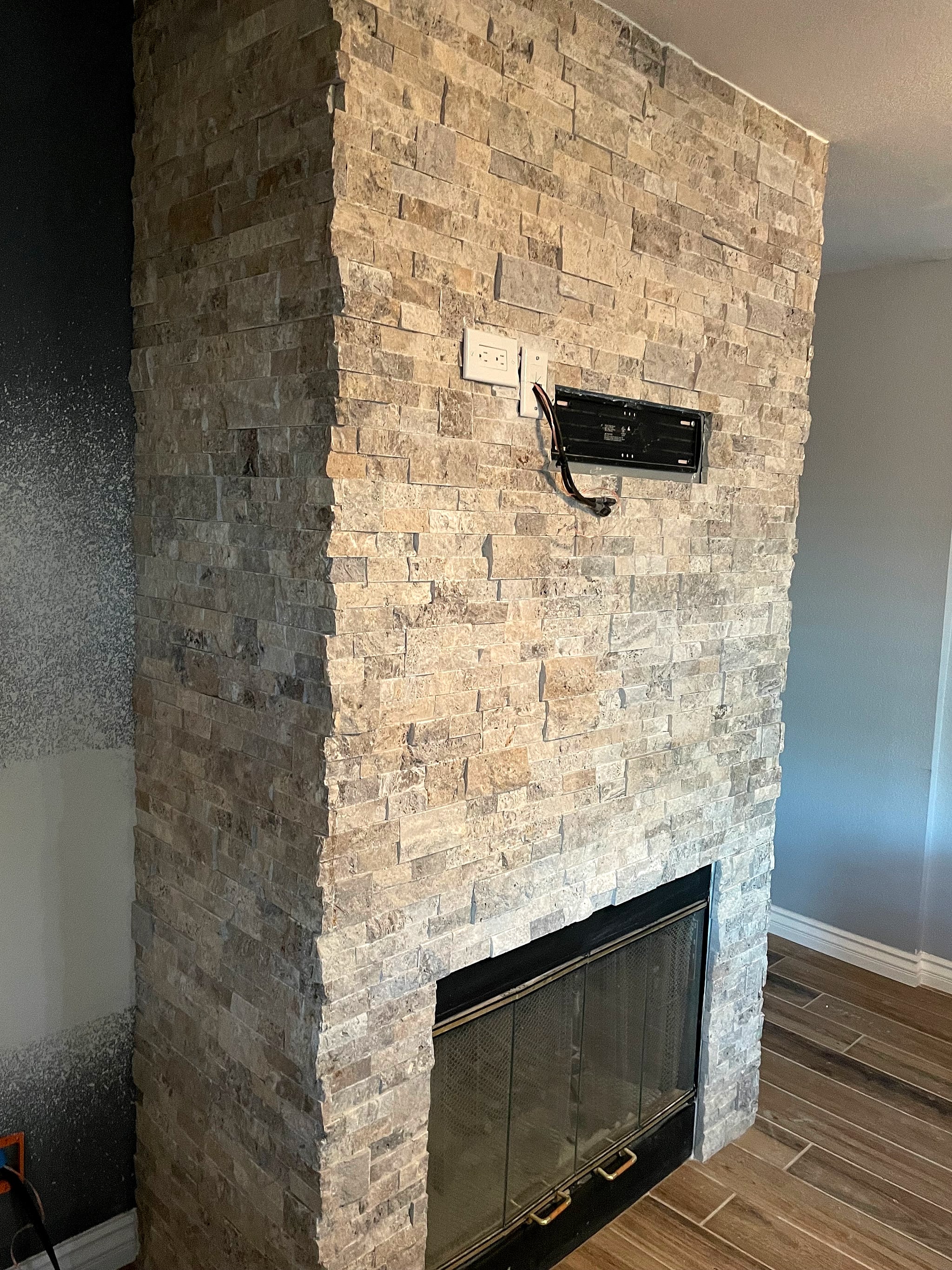 Stacked stone fireplace surround