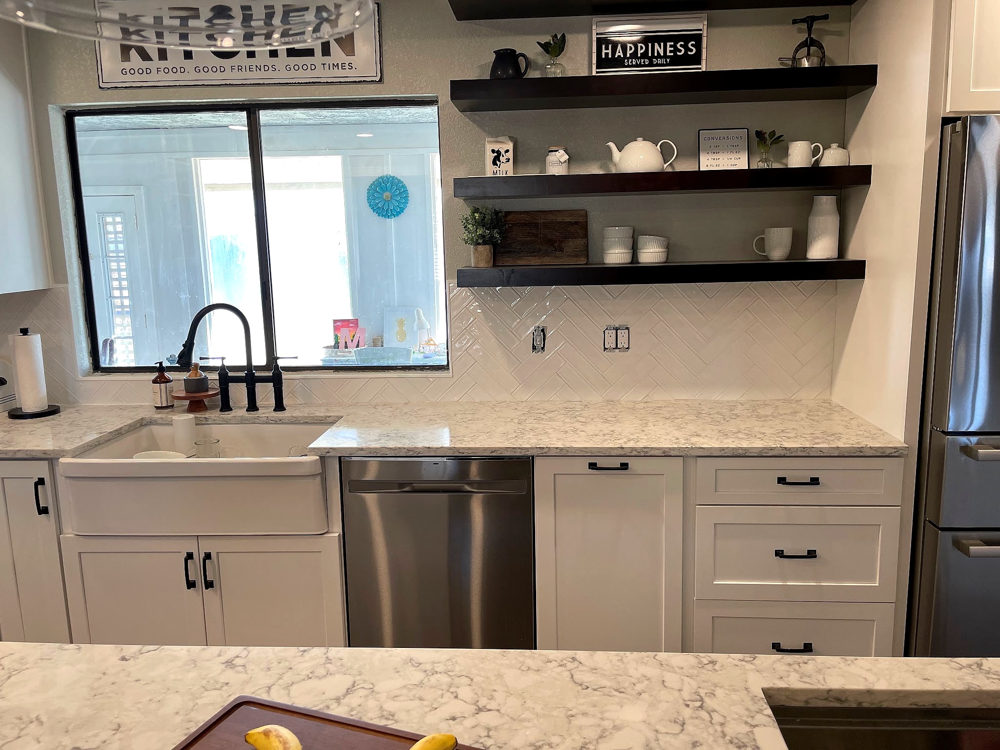 Farmhouse kitchen with a white tile backsplash